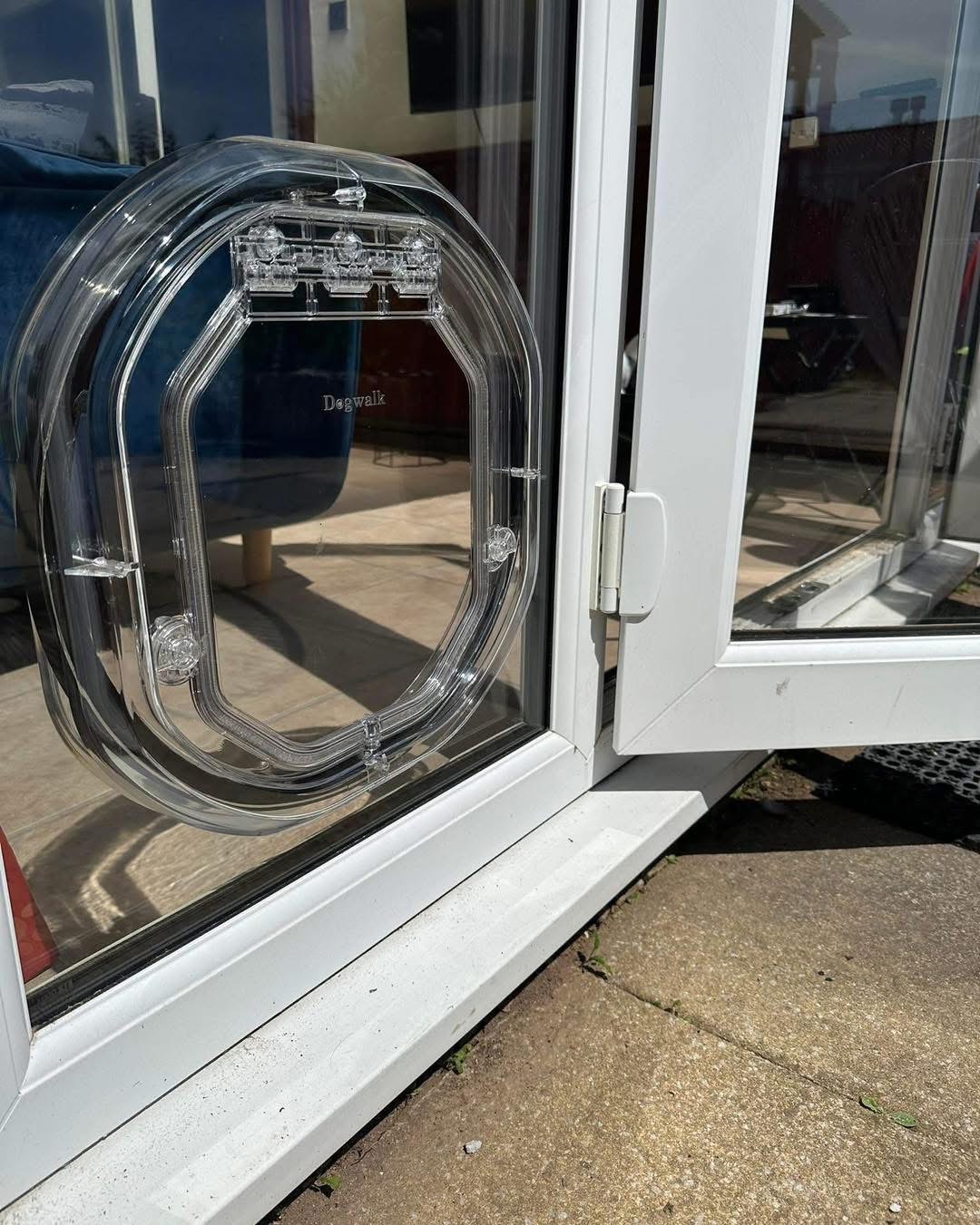 Pet-Tek cat flap professionally installed in a double-glazed glass patio door panel