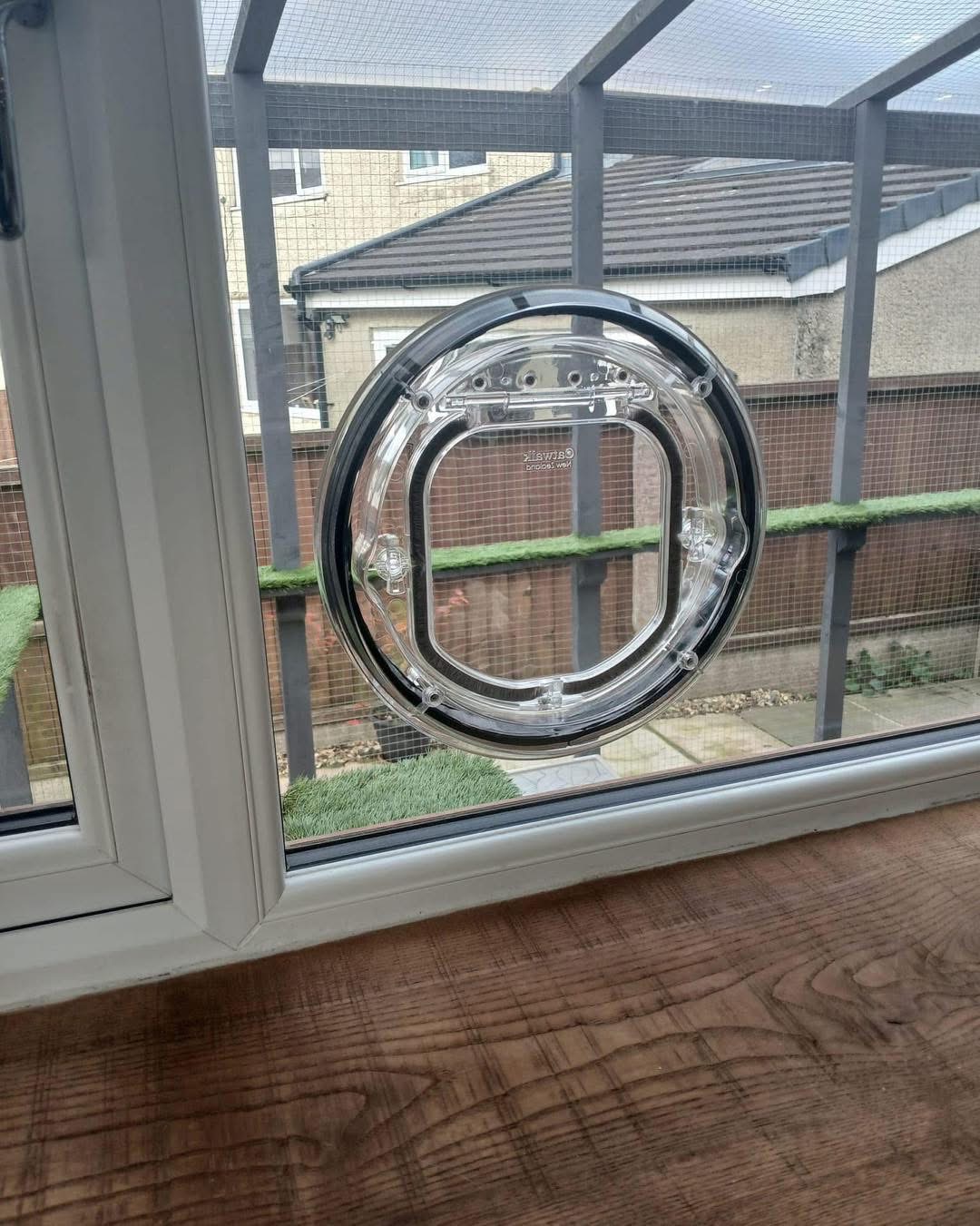 Pet-Tek cat flap fitted in glass with catio visible outside